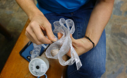 Step 1 to making the perfect Christmas bow is to fold the ribbon. Staff photos by Suzanne Freeman