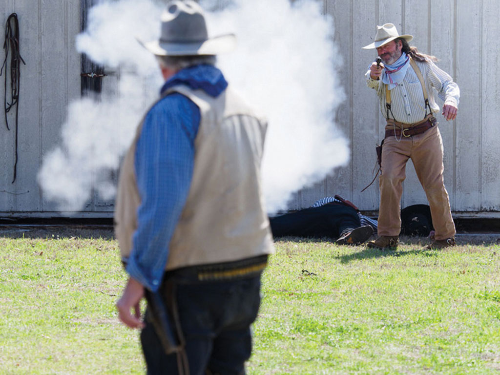 Sheriff 'Tex' Copsetta (foreground) takes a 'shot' at outlaw Cactus Jack during a Burnet Gunfighters show. The free public shows take place at 12:30 p.m. on Saturdays starting in March each year. File photo