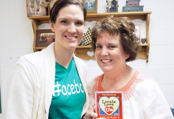 Rachel Denton (left) celebrates her 2015 Locals Love Us award with her mother, Darlene Denton, also a 2015 winner. Staff photo by Daniel Clifton