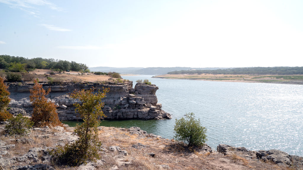 A view of Lake Travis from Pace Bend Park in Spicewood showcases the dramatic natural stonework that encompasses its south end. Enjoy miles of hiking and endless water sports as you explore the cliff faces and creeks that line the lake. Staff photo by Dakota Morrissiey