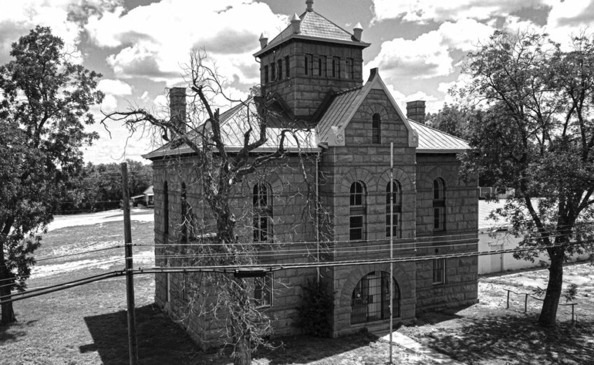 The Red Top Jail has been standing for 127 years on the corner of Oatman and East Haynie Street in downtown Llano. Built in 1895, it served as the Llano County jail until 1982. Now, visitors can tour the jail to experience history and hauntings firsthand. Staff photo by Dakota Morrissiey