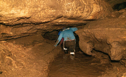 Paul Domingo, a native of Tyler, sloshed ahead of me through the partially flooded portions of the caverns. Depending on the weather, the whole cave system can be flooded out. Staff photo by Dakota Morrissiey