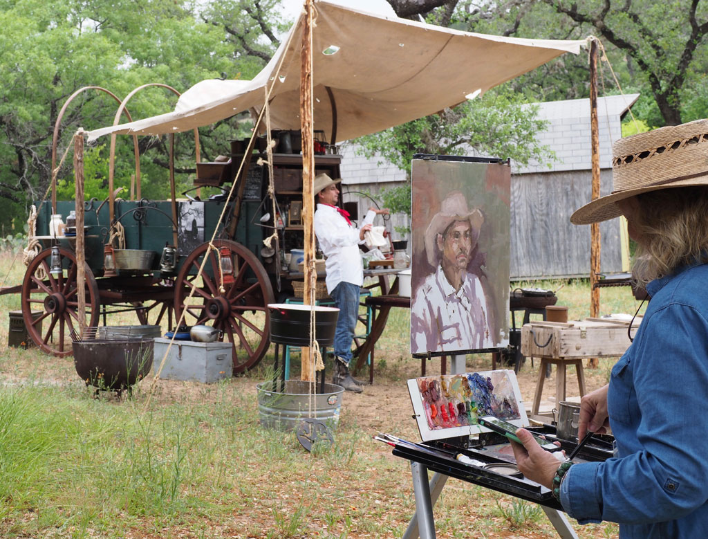 Donna Bland of Kingsland set up her easel on a stop at Candlelight Ranch during the 2018 Paint the Town. The 2022 event is April 24-30 and features Sculpture on Main, an ongoing outdoor exhibit. Staff photo by Daniel Clifton