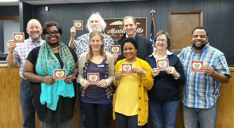 Members of the Marble Parks and Recreation Department happily accepted the Locals Love Us award for favorite park for Johnson Park. They include parks and public works administrative assistant Monique Breaux (front row, left), parks and recreation chairwoman Kendra Lewis, Commissioners Anitra Torns, Ann Berg, and Dedrick Thompson, Director Robert Moss (back row, left) and Commissioners Charles Watkins and Steve Hurst. Staff photo by Jennifer Fierro