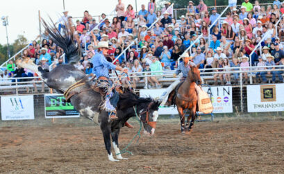 A bronc rider from the 2022 Marble Falls Rodeo hangs on tight. The 2023 rodeo is July 21-22 at the Charley Taylor Arena. Photo by Craig Lusinger