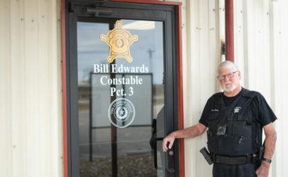 Llano County Precinct 3 Constable Bill Edwards outside his office at the East Llano County Annex in Buchanan Dam. He has been constable for 20 years and won a pile of Locals Love Us awards for his fair and generous attitude while on the job. Staff photo by Dakota Morrissiey