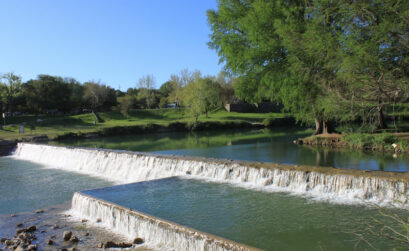 Jump into the glistening water at the Falls Dam in Blanco State Park. Photo by JoAnna Kopp