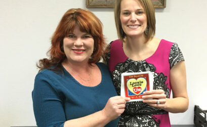 Cindi Ashford-Fry of The Picayune/KBEY presents Burnet County District Clerk Casie Walker (right) with the 2016 Locals Love Us award for favorite government employee for the Burnet area. Courtesy photo