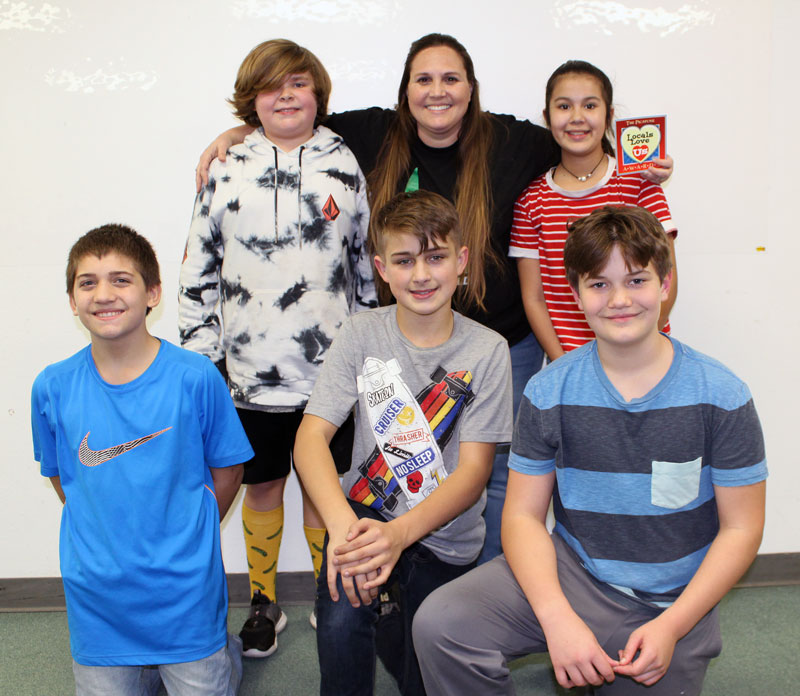 Burnet Middle School teacher Riki Campbell (back row, middle) with students Mason Roberts (back row, left), Alexia Palacios, Zane Hubbard (front row, left), Kyle Conklin, and Evan Joiner. Staff photo by Jennifer Fierro