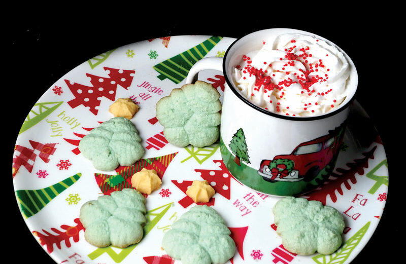 Daniel Clifton and his sons, Luke and Zach, baked these spritz cookies from a recipe book Daniel's late mother used. The project helped the author connect with his story and provide some artwork. Staff photo by Daniel Clifton