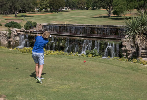 Brandi Jo Newman taking a tee shot off the No. 14 hole at Slick Rock Golf Course at Horseshoe Bay Resort. Staff photo by Jared Fields