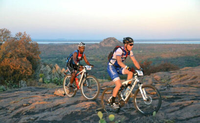 Two mountain bikers grind their way up the granite of Reveille Peak Ranch, 1,350 acres of outdoor paradise just 15 minutes from Burnet. Courtesy photo