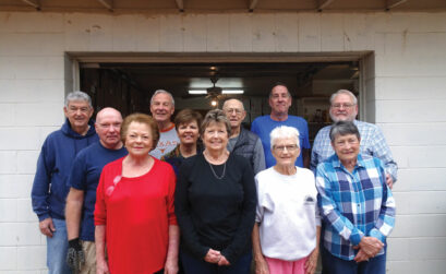 Sharing the Harvest food pantry volunteers (front row, from left) Craig Eskew, Michele Wilkins, Linda Smith, Judy Frederick, (middle, left) Steve Emert, Trudy Samek, (back, left) Sid Keelan, Mike Byrd, Ernie Smith, Kevin Henderson, and Rick Walker. Staff photo by Suzanne Freeman