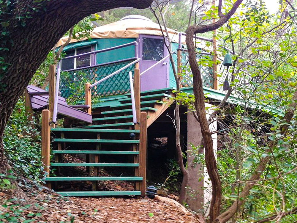 Book a few nights in Rainbow Hearth’s popular and luxurious treehouse yurt overlooking the property. Photo courtesy of Rainbow Hearth Sanctuary and Retreat.