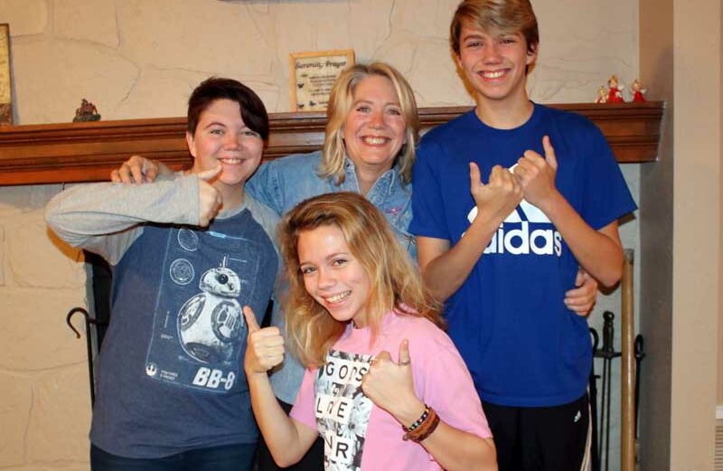 Martelle Luedecke (back row, center) was voted the 2018 Locals Loves Us favorite volunteer in the Burnet area by The Picayune readers and KBEY 103.9 FM Radio Picayune listeners. Martelle wanted to share the honor with her children, Briezie (front), J.P. (back row, left), and Samm. Together, they are known as ‘The Luedecke Bunch.’ Courtesy photo