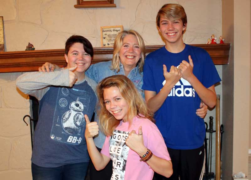 Martelle Luedecke (back row, center) was voted the 2018 Locals Loves Us favorite volunteer in the Burnet area by The Picayune readers and KBEY 103.9 FM Radio Picayune listeners. Martelle wanted to share the honor with her children, Briezie (front), J.P. (back row, left), and Samm. Together, they are known as ‘The Luedecke Bunch.’ Courtesy photo