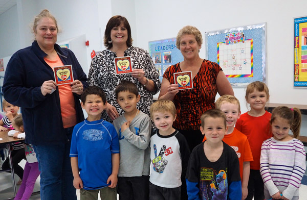 Packsaddle Elementary School staff and volunteers learned The Picayune readers and KBEY 103.9 FM Radio Picayune listeners definitely love them. All the Horseshoe Bay/Llano/Kingsland-area Locals Love Us education honors went to campus staff while the favorite volunteer honor went to a Packsaddle volunteer. Pictured are favorite volunteer Pam Peterson (left), favorite school administrator Packsaddle principal Maela Edmonson and favorite teacher Lisa Hill (with some of her students). Other Packsaddle Elementary winners included Misti Atkinson for favorite coach and Regina Beauchamp for favorite receptionist. Staff photo by Daniel Clifton