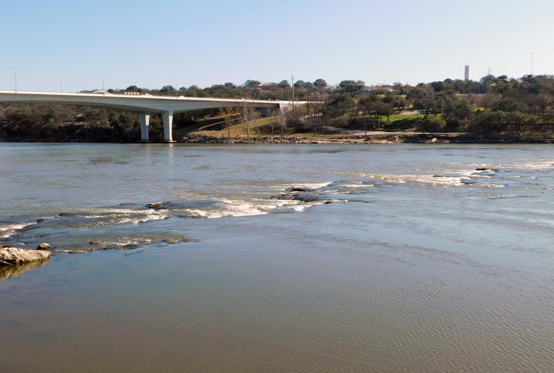 During the most recent drawdown of Lake Marble Falls by the Lower Colorado River Authority, the falls of Marble Falls are just visible. Staff photo by Jennifer Greenwell
