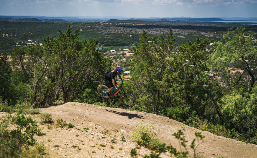 Michael Baker rides the trails at Spider Mountain Bike Park on Lake Buchanan in Burnet County. Photo by Ronnie Madrid