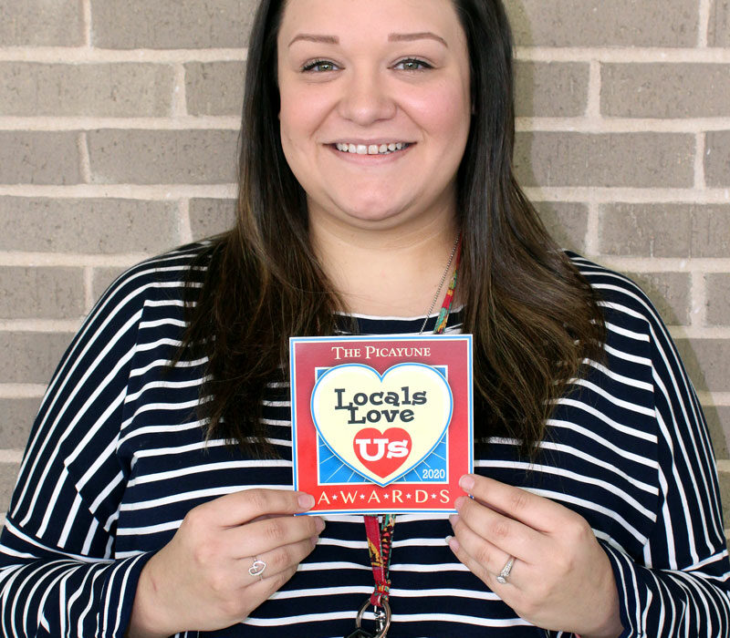 The Picayune Magazine readers and KBEY 103.9 FM Radio Picayune listeners voted Marble Falls Middle School's Ashley Ellis their favorite Locals Love Us receptionist. Staff photo by Jennifer Fierro