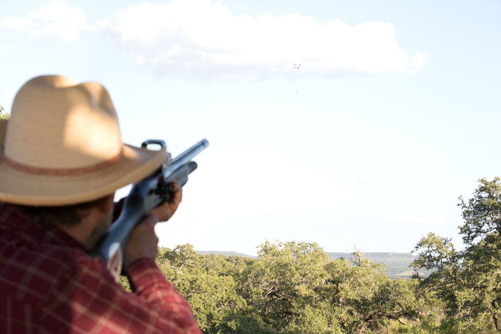 A shooter hits a clay pigeon at Copperhead Creek Shooting Club in Marble Falls. The facility is one of a few places to practice your shot in the Highland Lakes. Staff photo