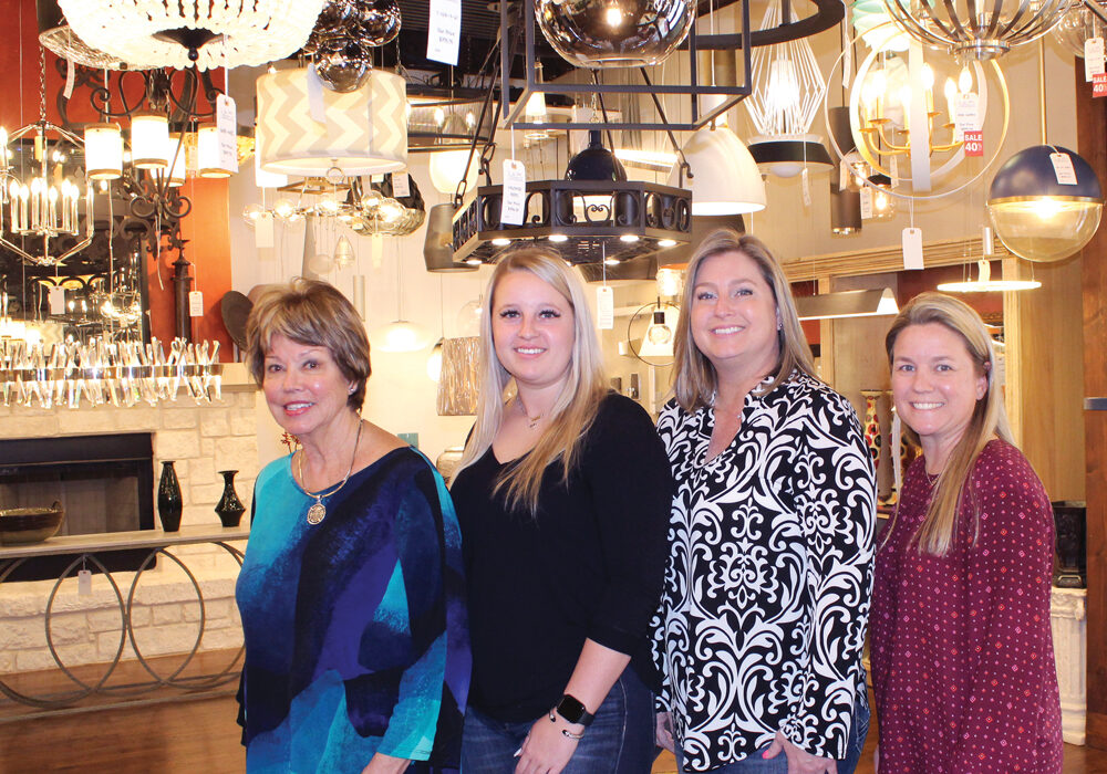 Lighting designers Gay Idom (left) and Courtney Pilley and co-owners Leslie Pilley and and Tanya Nolen at Broadway Showroom in Marble Falls. Staff photo by Jennifer Fierro