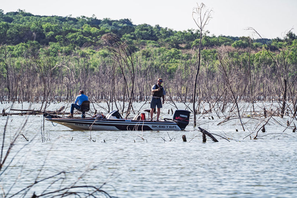 Anglers on Lake Buchanan look to hook a stringer of monster catfish or hard-fighting white or striped bass that make the Highland Lakes’ largest lake a fisherman’s paradise. Photo by Ronnie Madrid/Divine Radiance Photography