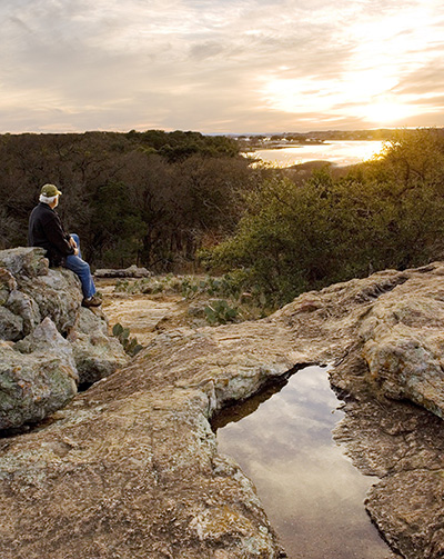 Enjoy a beautiful sunset after a hike at Inks Lake State Park near Burnet. Photo by Earl Nottingham/Texas Parks and Wildlife Department