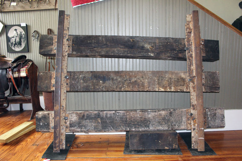 Weighing 450 pounds, this section of railroad now on display at The Falls on the Colorado Museum in Marble Falls was part of the Austin and Northwestern Railroad line that carried granite from Granite Mountain to the Texas State Capitol construction site in Austin in the late 1800s and early 1900s. Staff photo by Jennifer Fierro