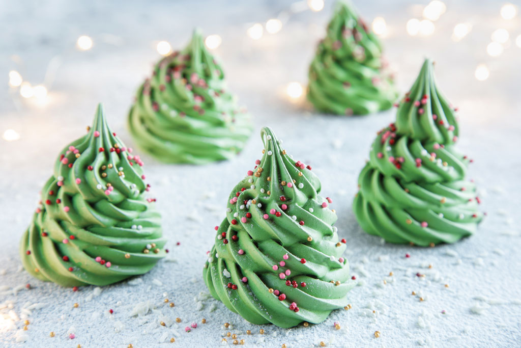 Using a pastry bag with a star tip, you can make merry meringue Christmas trees with the following recipe.