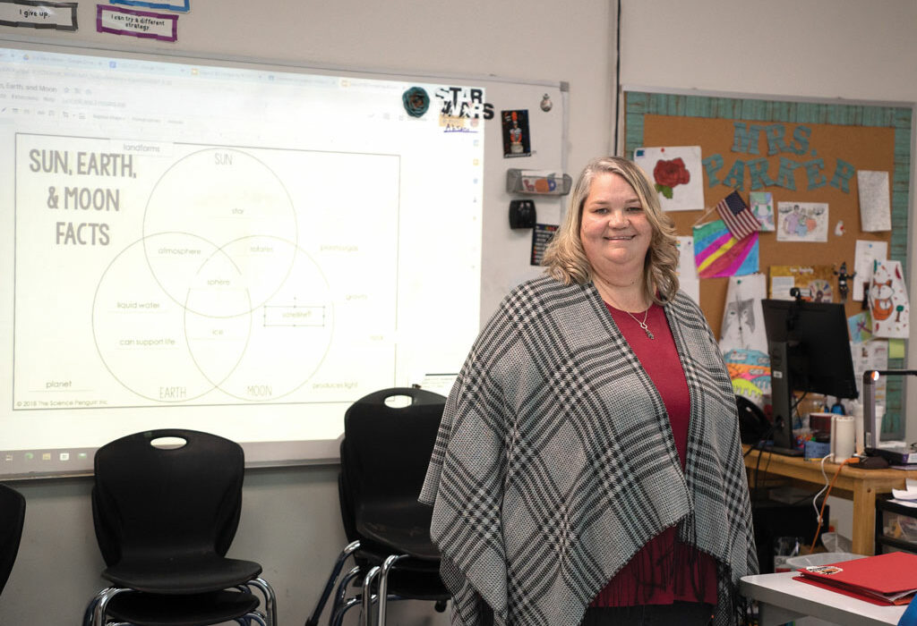 Allison Pike Parker in her fifth-grade classroom at Packsaddle Elementary School in Kingsland. Parker has been teaching in the same room for 17 years and has no plans to stop anytime soon. Staff photo by Dakota Morrissiey