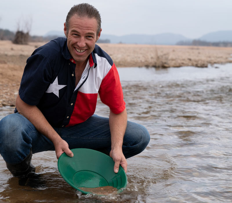 Cameron West pans for gold at the Kingsland Slab where RR 3404 crosses the Llano River. Panning is legal at the slab as well as Long’s Fish and Dig a few miles farther up the river. Photo by Ronnie Madrid