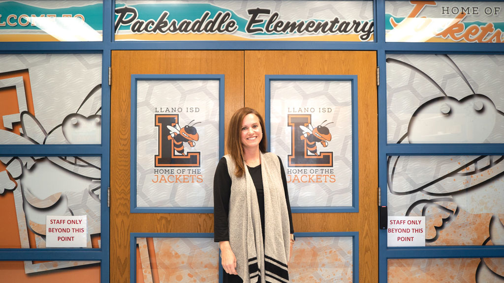 Packsaddle Elementary School Principal Jennifer Caropepe outside of the double doors of her beloved school. Staff photo by Dakota Morrissiey