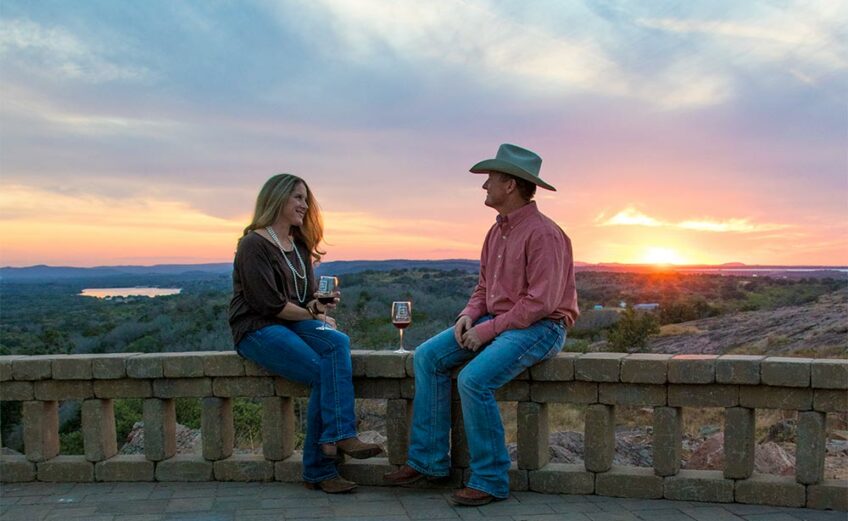 Whitney and James Hebert of Burnet enjoy the sunset at Torr Na Lochs Vineyard & Winery west of Burnet. You can sample a Highland Lakes wine at one of several wineries. File photo