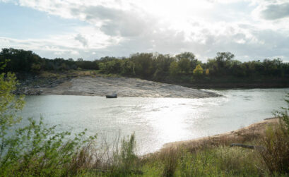 An enormous rock formation pushes out into Lake Travis at Shaffer Bend Recreation Area. Staff photo by Dakota Morrissiey